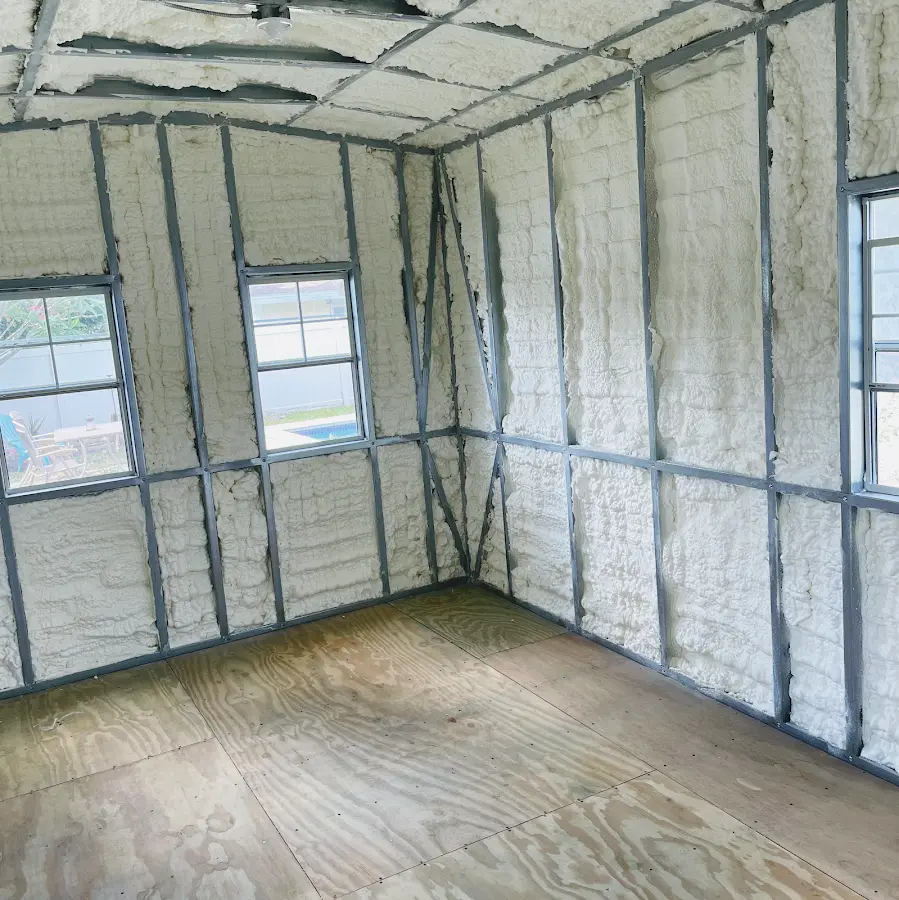Closed-cell spray foam insulation applied to wall cavities in a residential project in Raisin